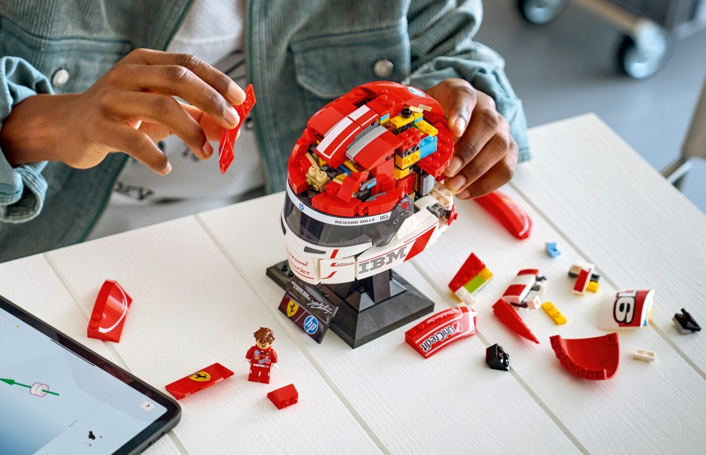 Official LEGO lifestyle image of 43014 Scuderia Ferrari HP Charles Leclerc Helmet on display