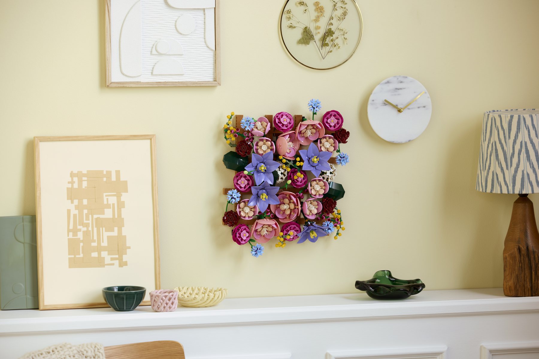 Official LEGO lifestyle image of LEGO Botanicals 11503 Flower Wall displayed on a wall