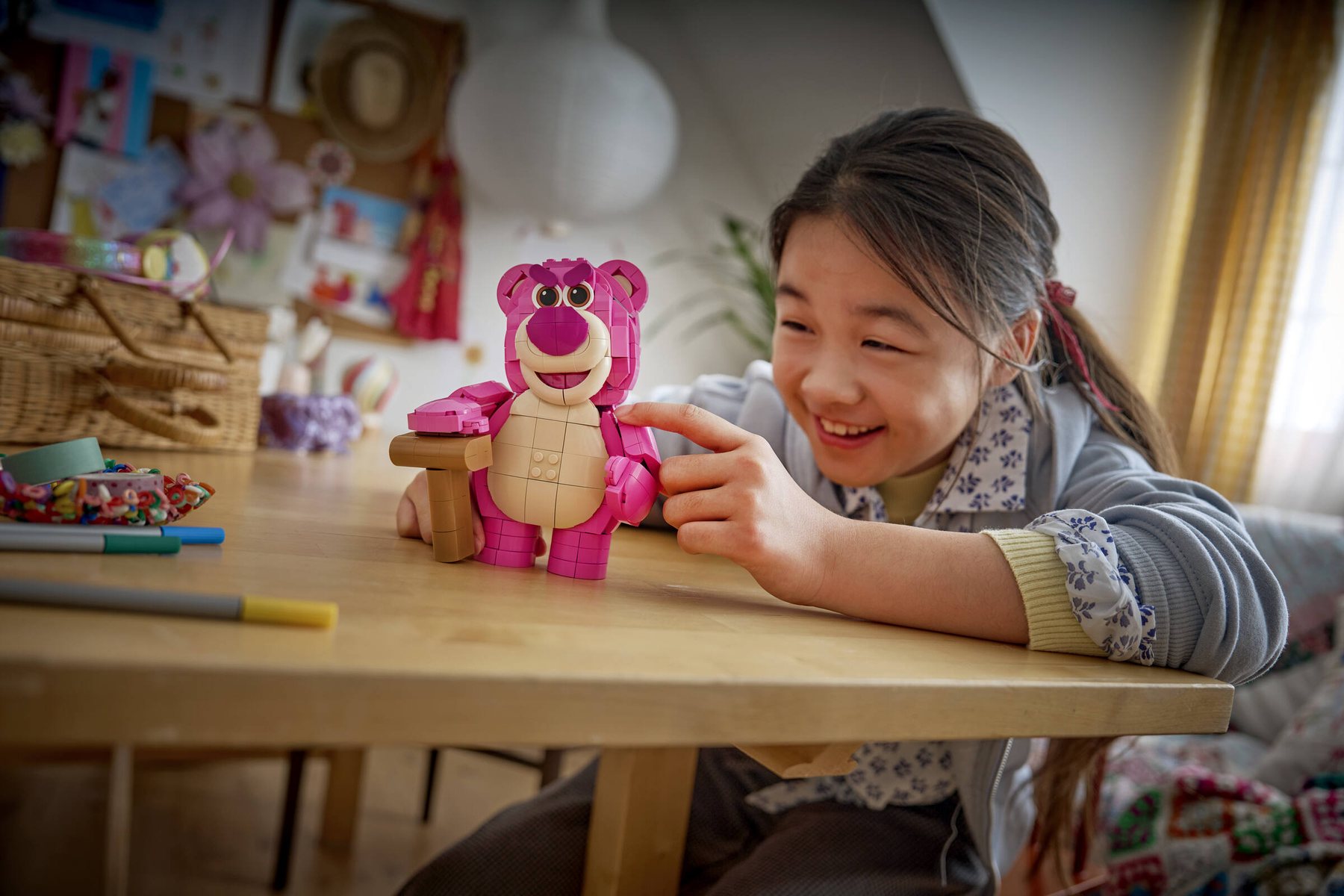 Official LEGO lifestyle image of 43306 Lotso in a room setting