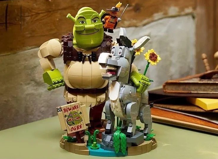 Leaked front-angle product image of LEGO Shrek 72423 showing Shrek, Donkey, the swamp-style base and Beware Ogre sign