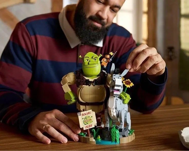 Leaked lifestyle image of LEGO Shrek 72423 being held in hand to show scale