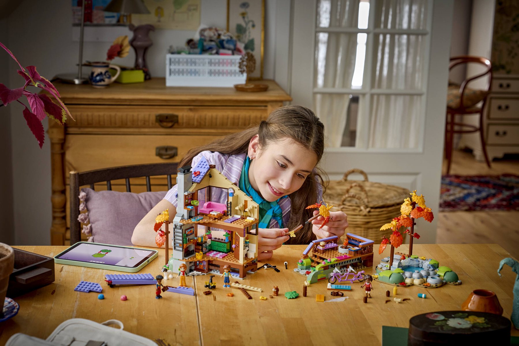 Official LEGO lifestyle image of Cozy Fall Forest Cabin