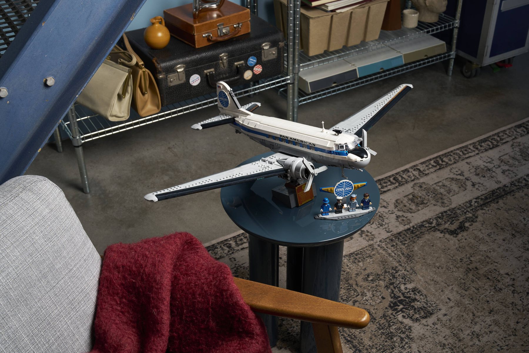 Official LEGO lifestyle image showing LEGO Icons 11378 Douglas DC-3 PAN AM Airliner on display in a room setting