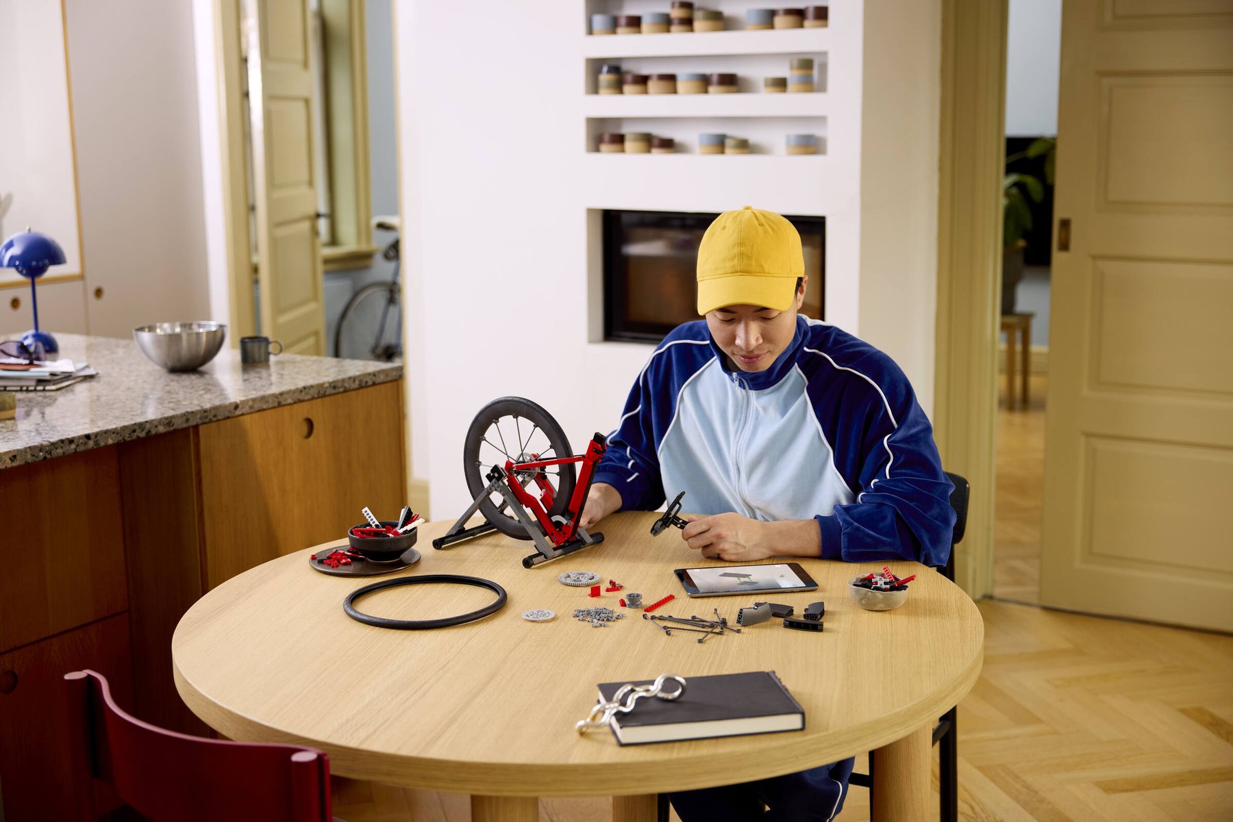 Official LEGO lifestyle image of LEGO Icons Road Bike 11380 in a home setting