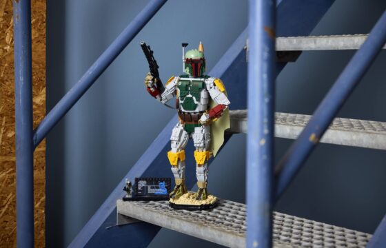 Built LEGO® Star Wars™ Boba Fett and info plaque with minifigure displayed on a blue metal staircase.