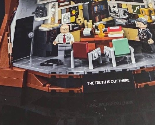 Close-up crop of the lower office section from the leaked LEGO Ideas 21369 The X-Files image