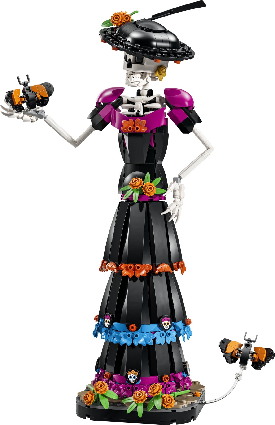 A LEGO® Ideas La Catrina set featuring a posable skeleton figure decorated with brick-built marigolds and skulls.