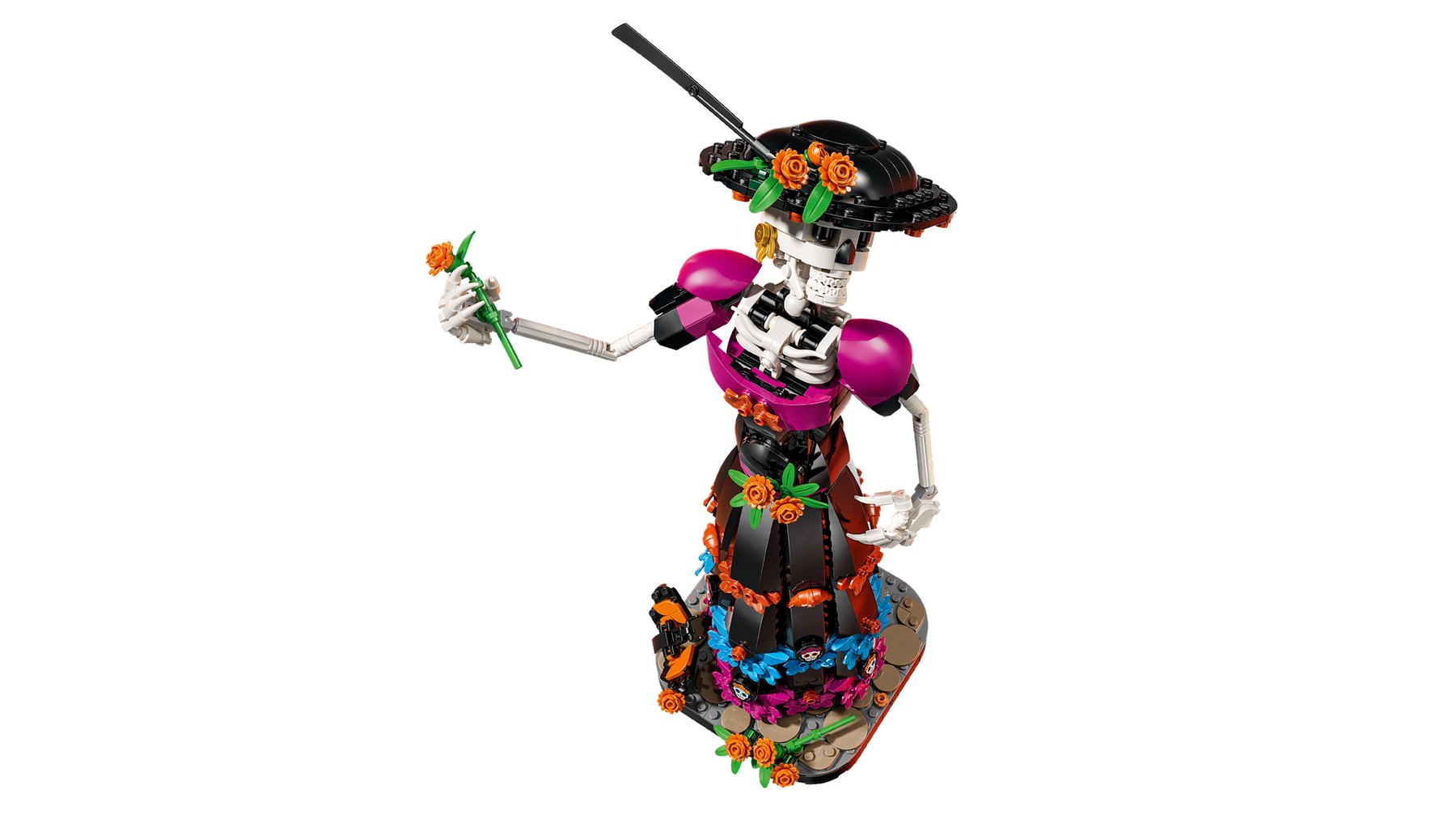 A LEGO® Ideas La Catrina set showing a posable skeleton holding a marigold flower in her outstretched hand.