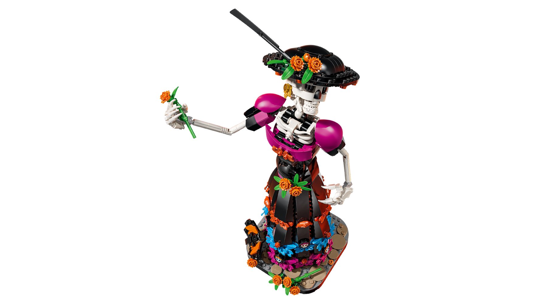 A LEGO® Ideas La Catrina set showing a posable skeleton holding a marigold flower in her outstretched hand.