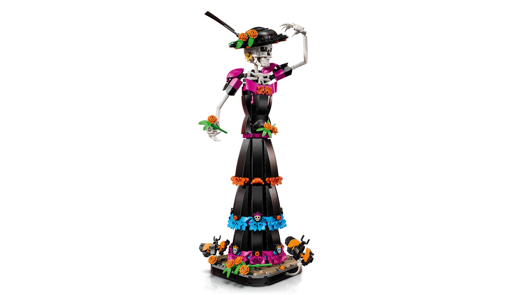 LEGO® Ideas La Catrina set showing a skeleton figure on a base holding a marigold flower in her outstretched hand.