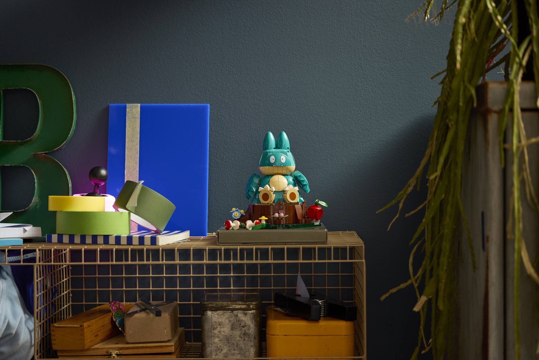Built LEGO® Pokémon™ Munchlax displayed on top of a metal shelving unit.