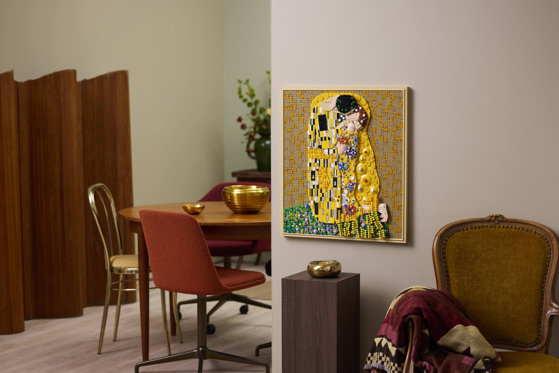 LEGO® Art Gustav Klimt – The Kiss shown hanging from a wall in a lounge; soft decor surrounds.
