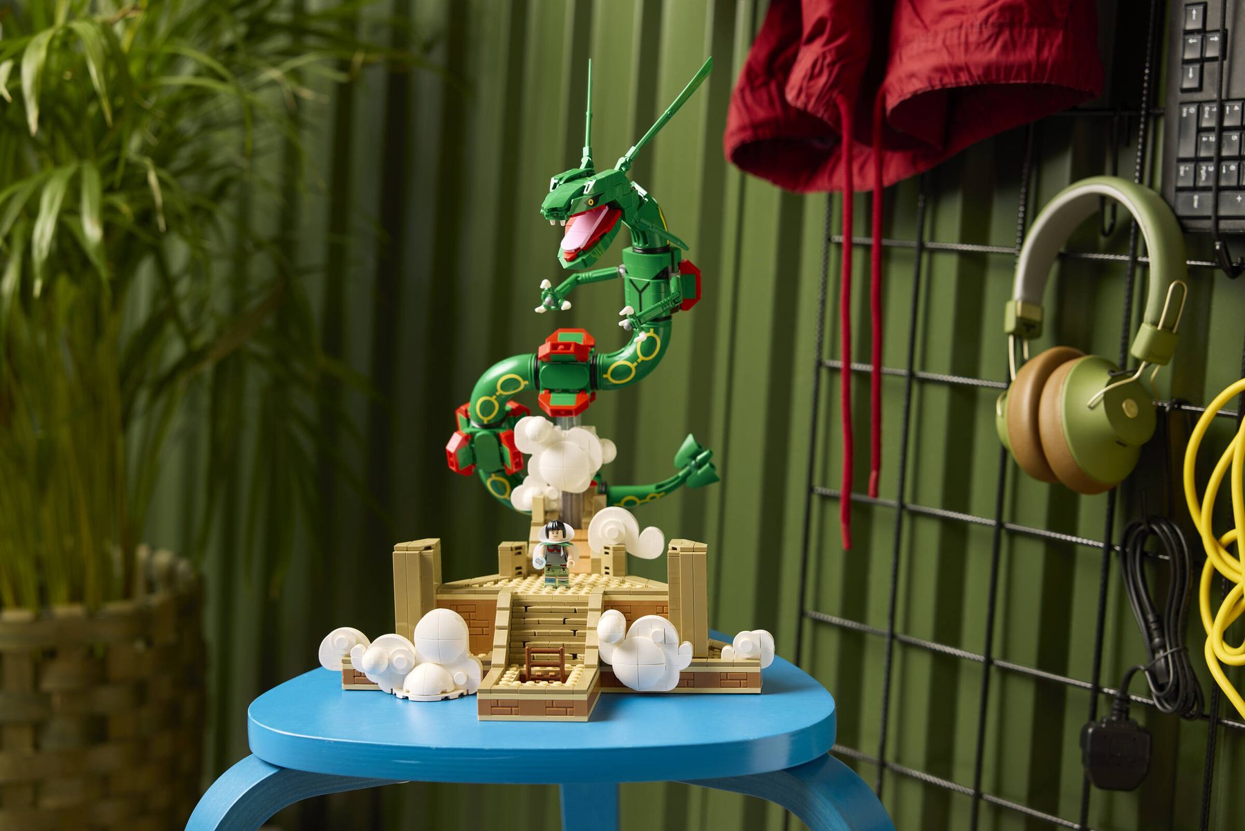 Built LEGO® Pokémon™ Rayquaza displayed on top of a blue stool.