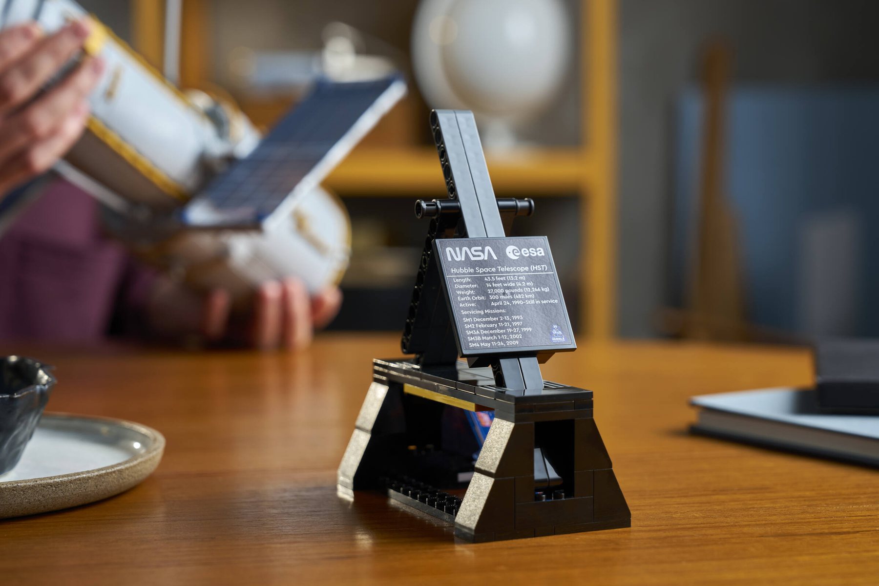Close-up of the stand on a LEGO® Icons Hubble Space Telescope set.