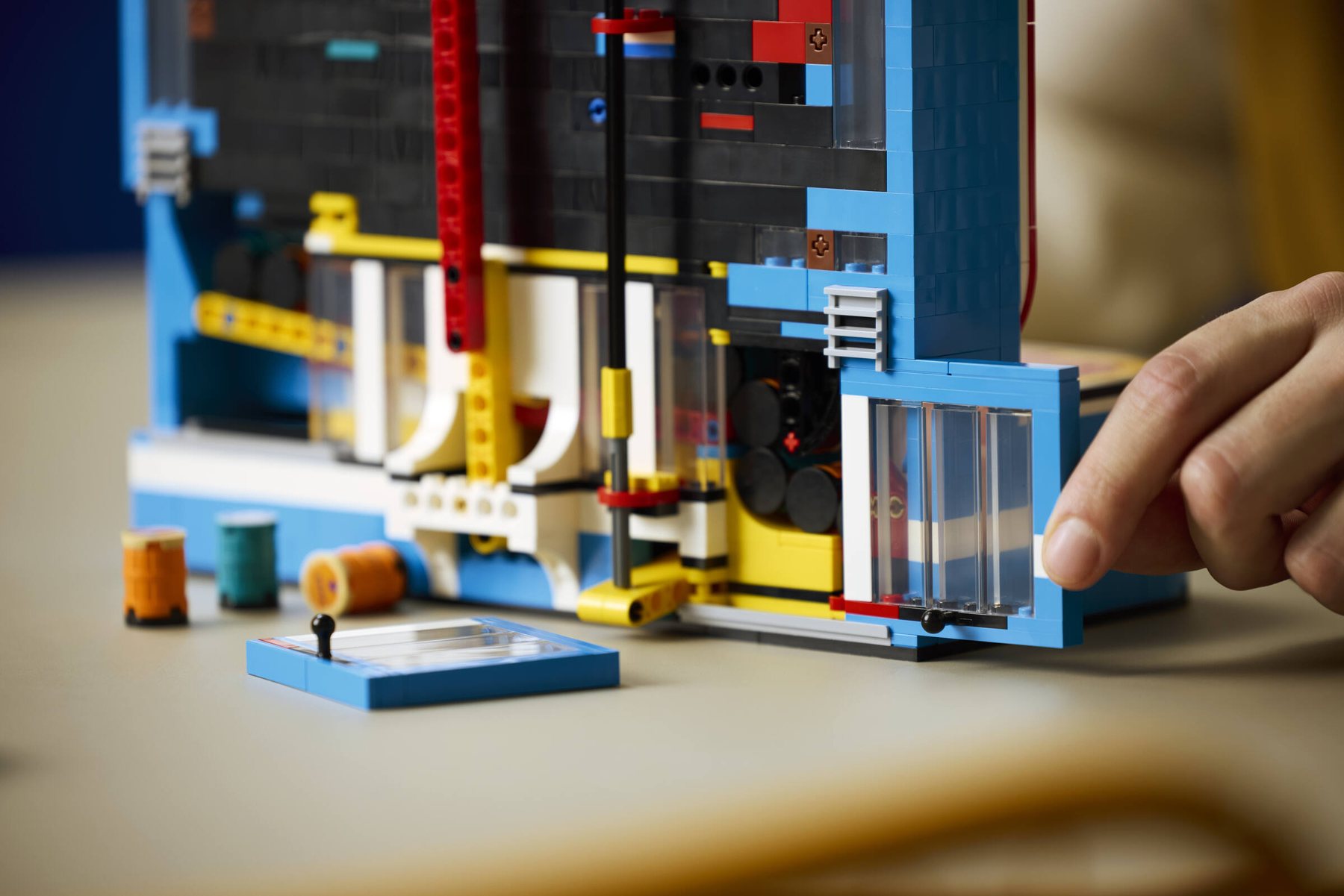 Close-up rear view of a LEGO® Donkey Kong™ Arcade set showing a hand opening an adjustable part.